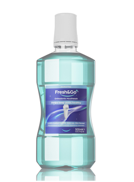 A bottle of mouthwash, the bottle is filled with a transparent clear light-blue liquid .