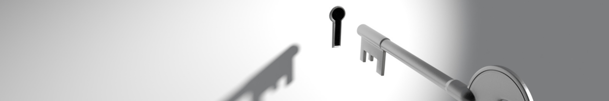 key going into keyhole on white background