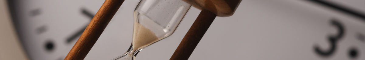 time clock background with hourglass in foreground